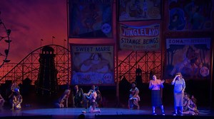 Phelim McDermott’s playful production of Mozart’s Così fan tutte transports audiences to the Coney Island boardwalk, complete with a performance from skilled snake charmer Zoe Ziegfeld—seen here when the production premiered in the 2017–18 season. On stage through March 14: bit.ly/3895r7L | The Metropolitan Opera