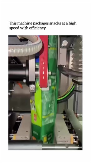 FUNNY SHORT CLIP on Instagram: "This snack packaging machine works using a vertical form fill seal system. A continuous roll of plastic film is pulled downward and shaped into a tube around a metal forming collar. At the same time, a precise amount of snack product is dropped through the center into the bag as it forms. Once filled, heat-sealing jaws close to seal the bottom and top, then cut the bag free in a fraction of a second. Sensors control weight, timing, and sealing temperature to keep