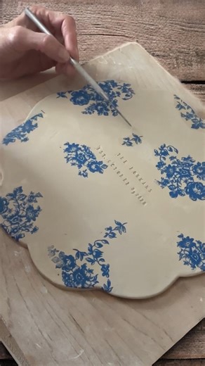 Happy Monday! 💙 Here’s a look at how I make my custom birthday plates—each one shaped by hand, stamped, and finished with blue floral details. This plate was a custom request for a slightly larger 8.5” size. This will be added to the shop so you can choose between the original 7” plate or the slightly larger version. Every part of the handbuilding process is slow—and sometimes I wish I could be just a little bit quicker! Working on finishing up all open orders—my little vacation to Germany is j