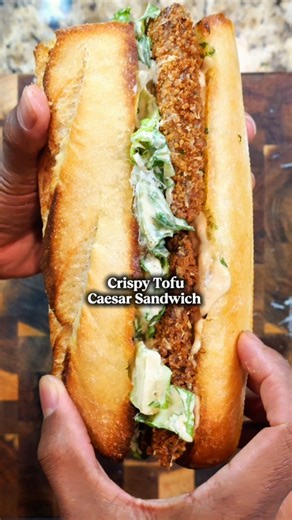 Brandon Horton on Instagram: "Comment "Recipe" + follow @_plantbasedbrandon for a link to access the full recipe sent straight to your inbox! Lets make A Crispy Tofu Caesar Sandwich that rivals the chicken version! Crispy Tofu Caesar Sandwich: 1 block Tofu 3 cups Romaine Lettuce, chopped French Bread 2-3 tbs vegan garlic butter Avocado oil for frying Marinade: 3-4 tbs olive oil 2-3 tbs soy sauce 1/2 lemon juice 1 garlic clove, grated 1 tbs dijon mustard 2 tbs nutritional yeast 1 tsp smoked papri