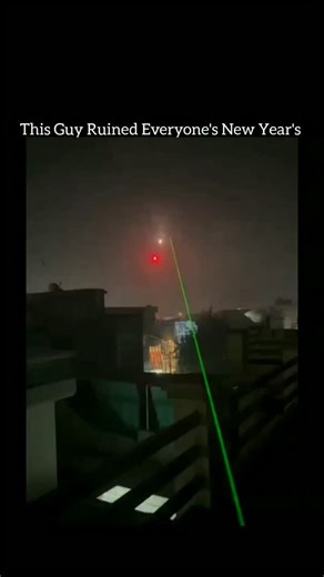 Fact Flick on Instagram: "This viral clip captures a shocking and hilarious moment when a man on a rooftop uses a powerful green laser to hit New Year’s fireworks mid-air 😳🎆. As the rockets rise into the night sky, the laser precisely targets them, causing unexpected explosions before they fully burst — completely changing the city’s fireworks show. The clip instantly grabbed attention online for its perfect timing, insane accuracy, and dark humor, showing how technology can unexpectedly inter