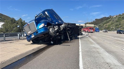Semi truck overturns on I-15 southbound, causing traffic delays