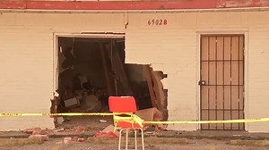2 hospitalized after car hits building in northeast Houston, officials say