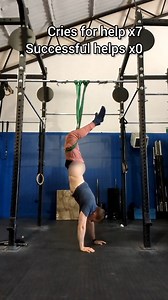 Guy's Pants Come Off as He Trains Upside Down With Resistance Band at Gym