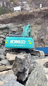 A Kobelco SK350 loading granite into a Scania tipper and Moxy ADT on a fjord in Norway. Look out for the feature on this machine in Awesome Earthmovers magazine. | RPA Media