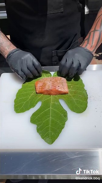 Salmon wrapped in fig leaves #kendrickbbq #fig #fyp #leaves #salmon #bbq @traegergrillsofficial