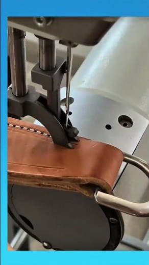 Leather belt keeper stitched neatly, securing the strap with durability and refined craftsmanship.