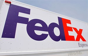 FedEx to close stores, corporate offices as package volume drops