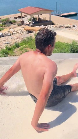 130ft Concrete Slide into a private lake