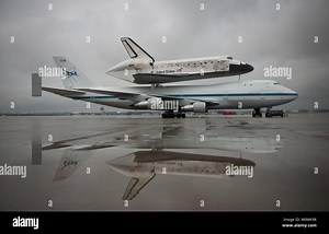 Space shuttle Discovery, mounted atop a NASA 747 Shuttle Carrier Aircraft (SCA) is seen a few hours before being demated at Washington Dulles International Airport on April 17, 2012, in Sterling, Viirginia.  Discovery, the first orbiter retired from NASAÕs shuttle fleet, completed 39 missions, spent 365 days in space, orbited the Earth 5,830 times, and traveled 148,221,675 miles. NASA will transfer Discovery to the National Air and Space Museum to begin its new mission to commemorate past achiev