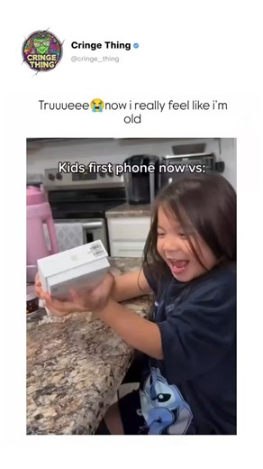 Cringe Things on Instagram: "The post features a split-screen video contrasting a young girl's excitement unboxing a modern smartphone with nostalgic displays of colorful toy flip phones from the 2000s, like those themed with Mario and Spider-Man, underscoring generational tech shifts. Captioned "Truuueeenow i really feel like i’m old," the content struck a chord, amassing 15,000+ likes and replies evoking memories of old ringtones while debating if smartphones at young ages spoil children. Rece