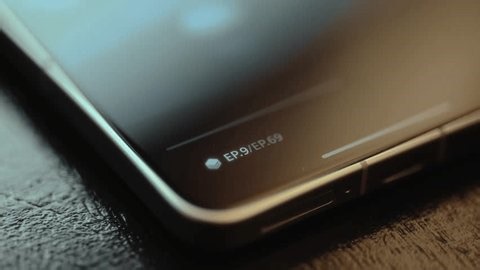 clip-3987654201-scrolling-list-episodes-serial-film-on-smartphone