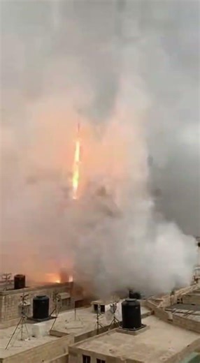 Rocket Launch Amidst Urban Chaos: A Tense Moment #RocketLaunch #MiddleEastConflict