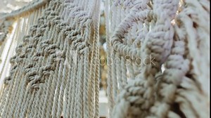 Decorated wedding arch. Wedding ceremony in the woods. Macrame. Slow motion shot.