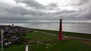 Lighthouse tower Lange Jaap in Den Helder drone aerial footage along the sea near the island of Texel in North Holland, The Netherlands.