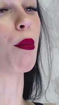 BEAUTIFUL GIRL WITH FULL RED LIPS SMOKING CIGARETTES
