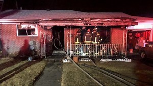 Firefighters battle early morning house fire