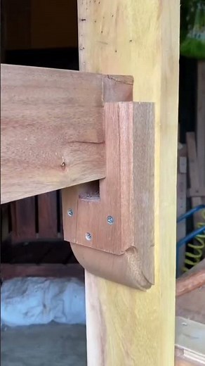 the process of installing wooden beams on a frame attached to wooden posts #construction #popular