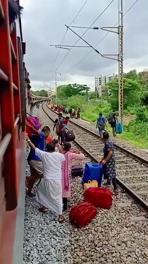 A video shared by IAS officer Awanish Sharan that shows a woman and other passengers crossing a railway track with luggage just in the nick of time before the arrival of a train, has gone viral on social media. | News18