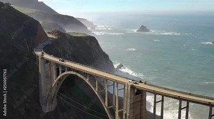 4k Aerial flight Bixby Bride California State Route 1 Scenic road at the pacific Ocean on the west coast USA