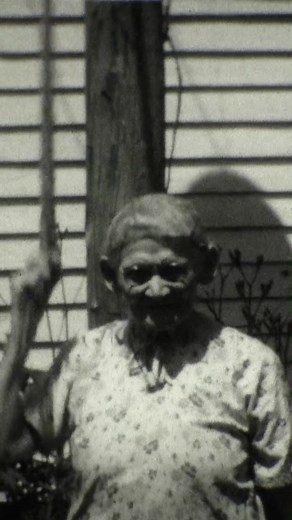 Meet Mrs Wilson, ringing the dinner bell, Illinois, 1929 #vintage #film #old #history #supper #dinner #oldfashioned