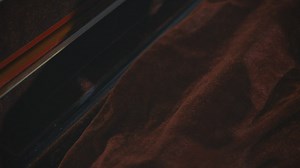 Violinist carefully removing his violin from its case - Free Stock Video