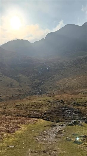 The Buttermere Infinity Pool is a natural hillside pool where the still water lines up perfectly with the valley, making it look like it spills straight into the mountains. | UK Hidden Gems