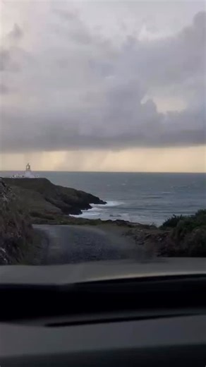 Through wind and rain, towards Strumble Head Lighthouse #wales #cymru #visitwales #walescollective #walescoastpath #westwales #explorewales #walesphotography #uk #pembrokeshire #strumblehead #lighthouse | Around Tenby