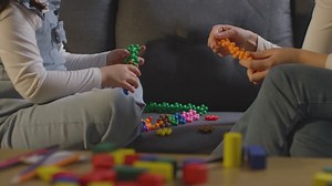 Close Up Of Girl On ASD Spectrum Being Helped Or Assessed By Female Teacher Or Educational Psychologist At Home 1 | Free Stock Video Footage