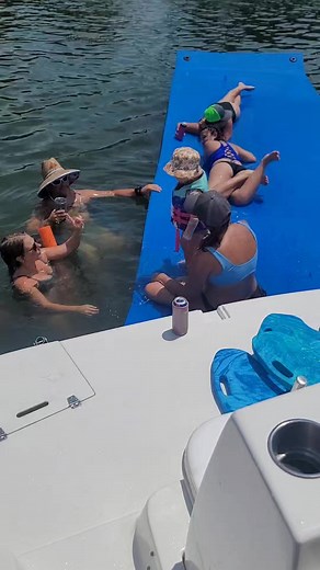 Watch how FloatingMats makes this first time swimmer 🏊‍♀️ feel comfortable as the foam allows for stable feet and dips a bit towards mamma, but still lays flat others on the mat... Inflatables and cheap foam knock-offs can't do this! #FloatingMats #OceanMat #FloatOn | Floatingmats.com