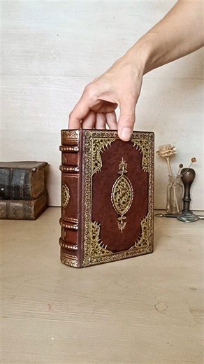 A little treasure for @iluvmemories7 . Brown leather binding with gold tooled decoration and hand painting inside the medallions and the corners. . . . #leatherjournal #leatherbinding #artjournal #journaling #handmade #oneofakind #booklover #bookcollector #booksofinstagram #bookbinding | TeoStudio