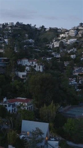clip-4103303921-forwards-fly-above-residential-suburbs-luxury-properties