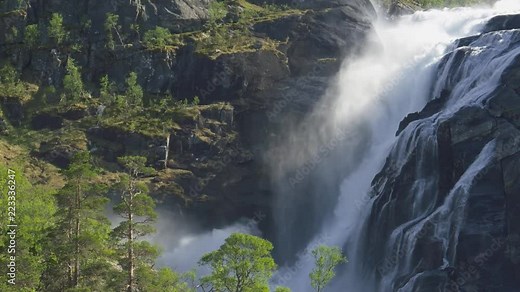 Norway landscape with waterfall, river and mountains. Hardangervidda National Park. 4K, UHD
