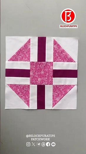A pink and purple geometric quilt block pattern with a symmetrical design featuring triangles