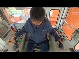 How female crane operator works high above ground