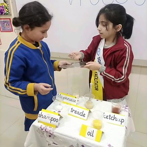 Students of 2-Yellow, experimenting with different liquids to check the viscosity. | Beaconhouse School System, Kindergarten Branch, Satellite Town, Rawalpindi