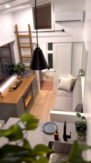 You dream it, we can build it. Check out this custom fireplace with hidden TV feature we did in this new tiny home design! We do 90% of everything that goes into our tiny homes right here in our facility. Giving the freedom and flexibility to customize special features like this. What do you think? #tinyhouse #tinyhome #adu #modularhome #tinyhouse #tinyhomegoals #tinyhouseliving #tinyhomelife #tinyhouseonwheels #smallspaceliving #designideas | Summit Tiny Homes
