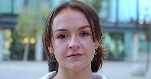 Closeup Portrait of a Teenage Female Student Looking at Camera Seriously