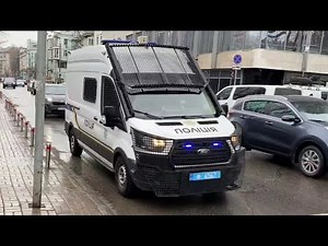 responding national police of Ukraine with siren and lights drive around kyiv