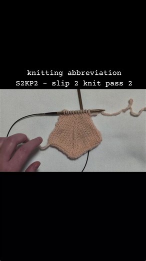 knitting abbreviation S2KP2 - slip 2 knit pass 2 #knittinghowto #knittingterms #knittingabbreviations #knittingtutorial #knittingforbeginners