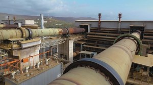 Rotary kiln equipment in operation at a Rotary Kiln-Electric Furnace （RKEF） Process ferronickel smelting plant in Indonesia.The calcined rotary kiln is rotating in the cement plant. Rotary kiln