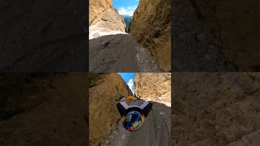 Wingsuit base jump but double POV.