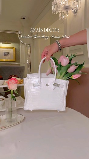 Where high fashion meets home artistry, Anaïs Luxurious Handbag Vases are the couture statement pieces. Designed to hold blooms treasure in the luxury handbags. These vases bring an air of elegance to any space. Transforms florals into wearable art for your home. | Anaïs Candle