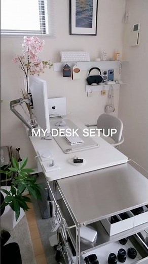 A simple, white desk setup and my favorite wireless charger, the Belkin BoostCharge Pro. #desktou...