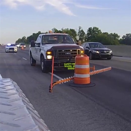 This device allows workers to safely move traffic barrels from one side to another.