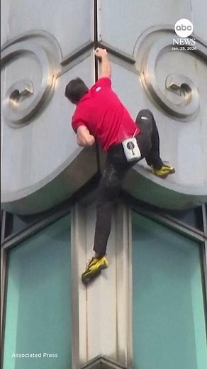 American climber Alex Honnold scales Taipei 101 tower without ropes