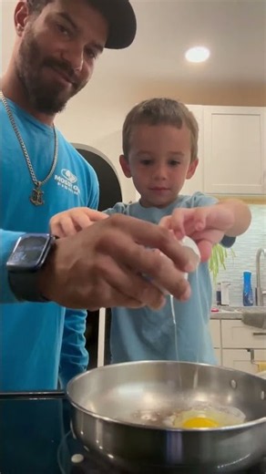 Father and Son Fall Down Laughing While Cooking Breakfast Together