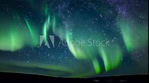 Quietly dancing in the dark the aurora waves pulse and ripple in an otherworldly performance.