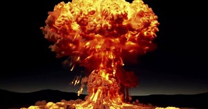 A fiery nuclear explosion illuminates the night sky with a mushroom cloud