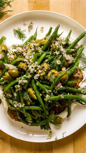 Crispy potatoes, green beans, briny olives, tangy yogurt? Hello! Sign me up. Comment “recipe” and I’ll send you the link! #potatoesandgreenbeans #greenbeans https://zestfulkitchen.com/green-beans-and-potatoes-recipe/ | Zestful Kitchen